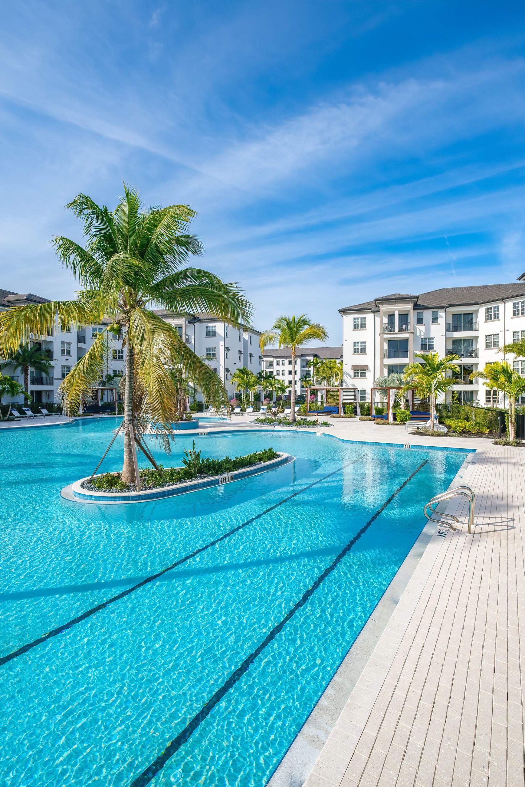 Inspira resort style pool with palm tree in the middle